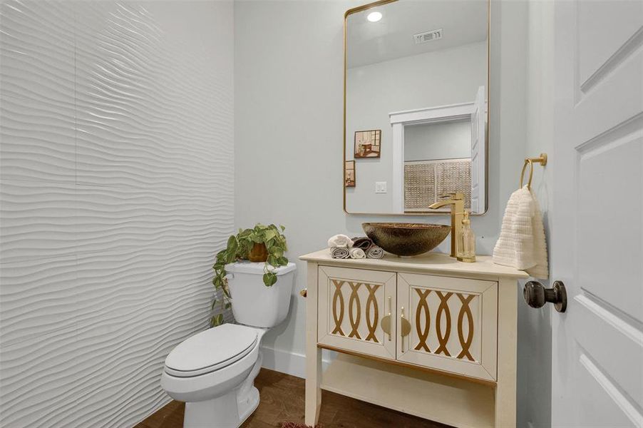 Bathroom featuring vanity and toilet