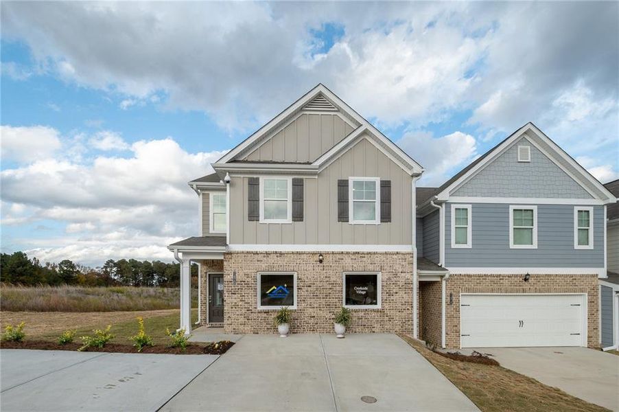 Front exterior of a new home in Creekside Village, Lithonia, GA, highlighting curb appeal (Image 23). Front exterior of a new home in Creekside Village, Lithonia, GA, highlighting curb appeal (Image 23).