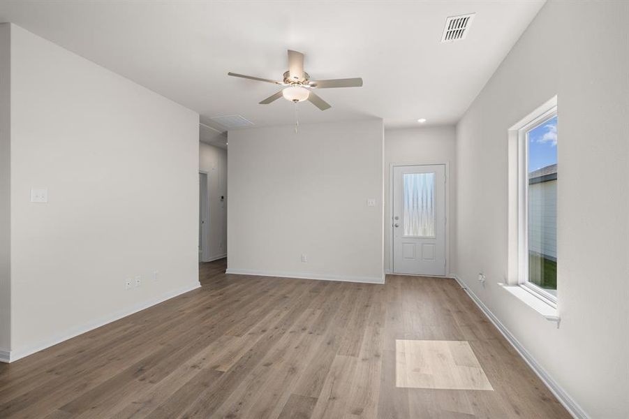 Unfurnished room with light wood-type flooring, a ceiling fan, and recessed lighting