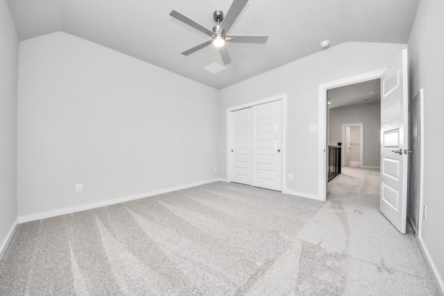 Generously sized secondary bedrooms featuring spacious closets, soft and inviting carpeting underfoot, large windows allowing plenty of natural light, and the added touch of privacy blinds for your personal retreat.