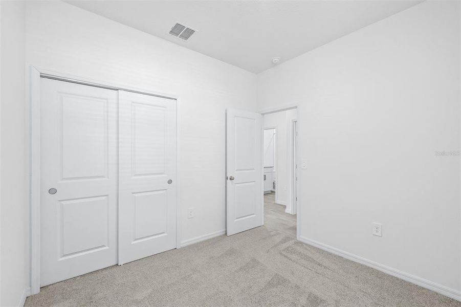 Spacious, unfurnished interior of a new home in The Grove at Stuart Crossing - Premier Series, Bartow (Image 35).