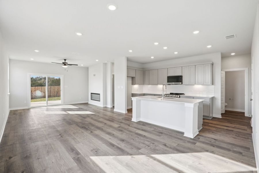 A large kitchen with white cabinets.