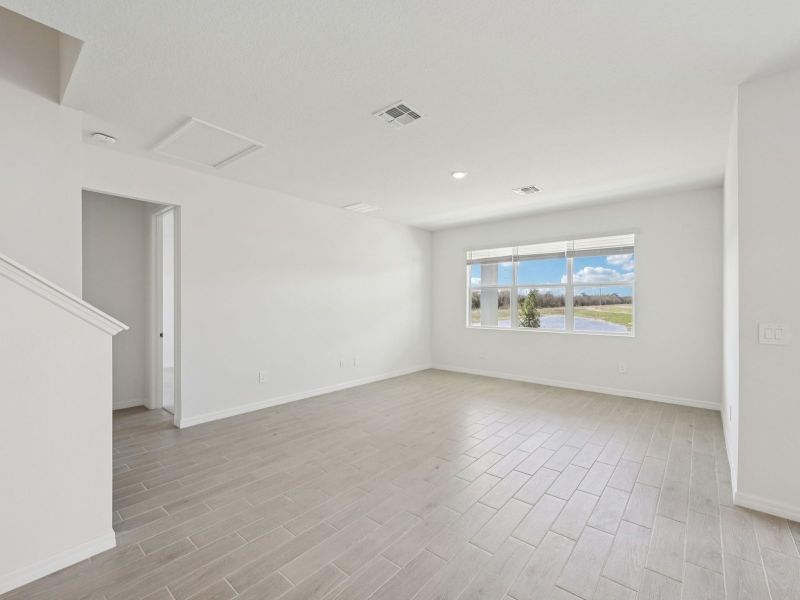 Spacious, unfurnished interior of a new home in Coasterra - Reserve Series, Palmetto (Image 10).