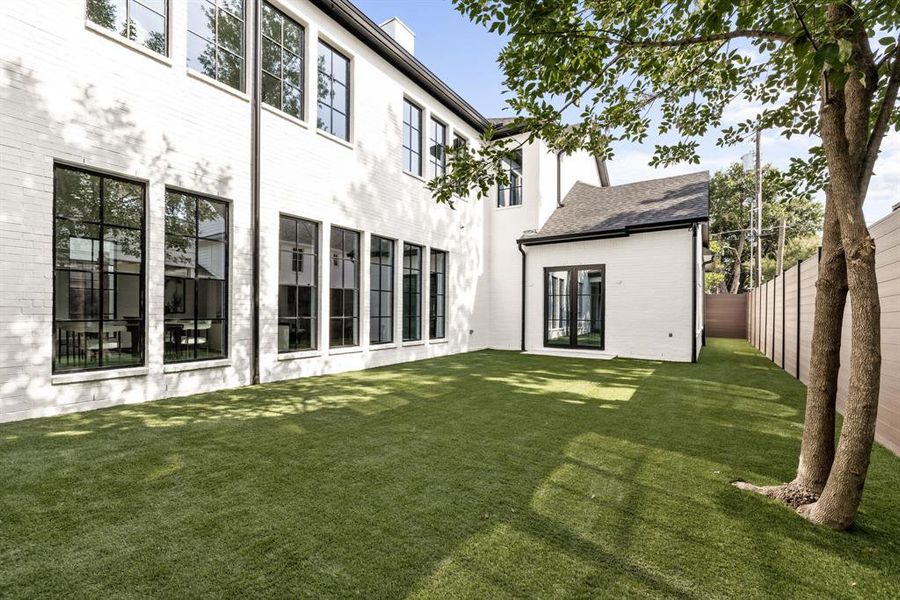 Rear view of property with french doors and a fenced backyard Rear view of property with french doors and a fenced backyard