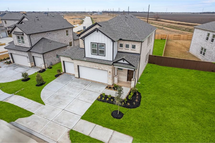 Front exterior of a new home in Creekhaven, Arcola, TX, highlighting curb appeal (Image 15).