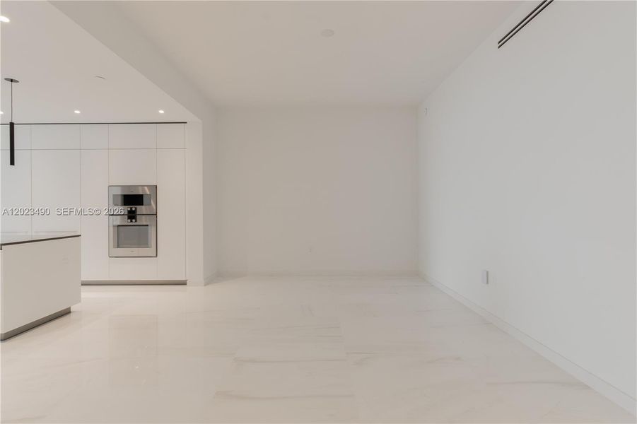Spacious, unfurnished interior of a new home in Aston Martin Residences, Miami (Image 25).