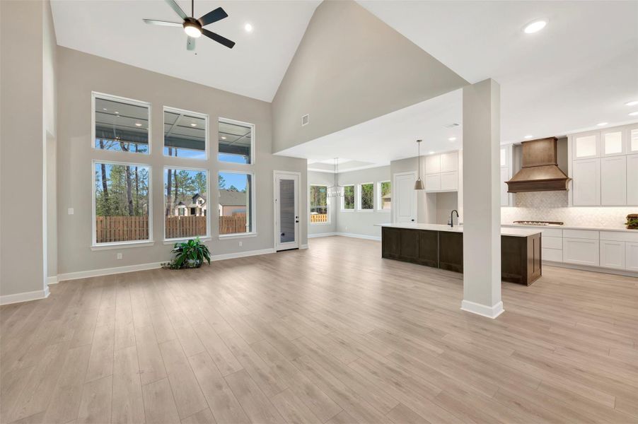 Wow!  High ceilings, LARGE windows all compliment this beautiful Living space that is open to the Kitchen!