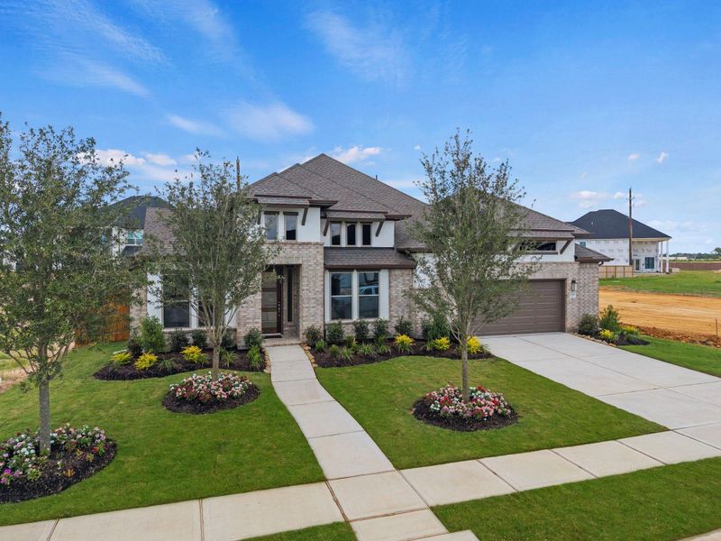 Front exterior of a new home in Dunham Pointe, Cypress, TX, highlighting curb appeal (Image 21). Front exterior of a new home in Dunham Pointe, Cypress, TX, highlighting curb appeal (Image 21).