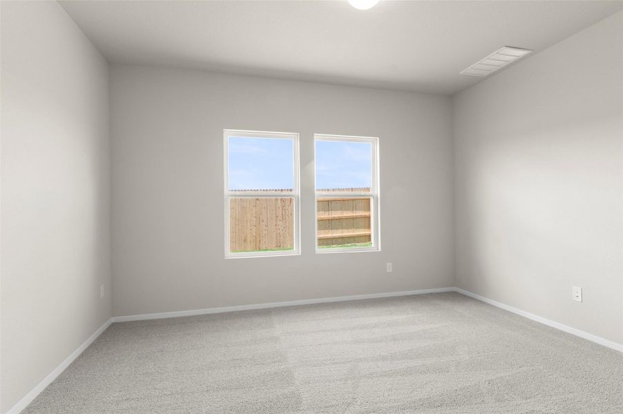Carpeted empty room with baseboards Carpeted empty room with baseboards