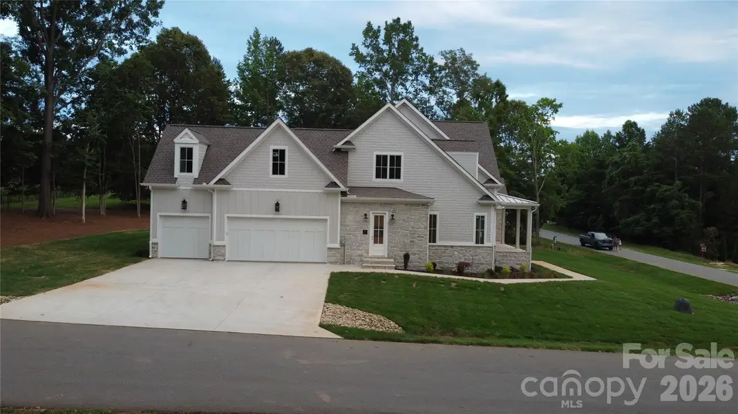 Front exterior of a new home in , Mooresville, NC, highlighting curb appeal (Image 2). Front exterior of a new home in , Mooresville, NC, highlighting curb appeal (Image 2).