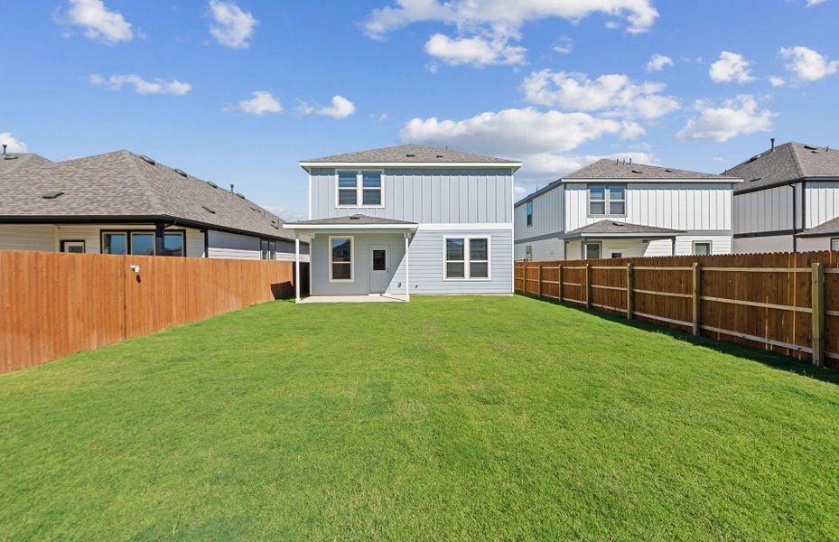 Rear view of house with a patio and a fenced backyard Rear view of house with a patio and a fenced backyard