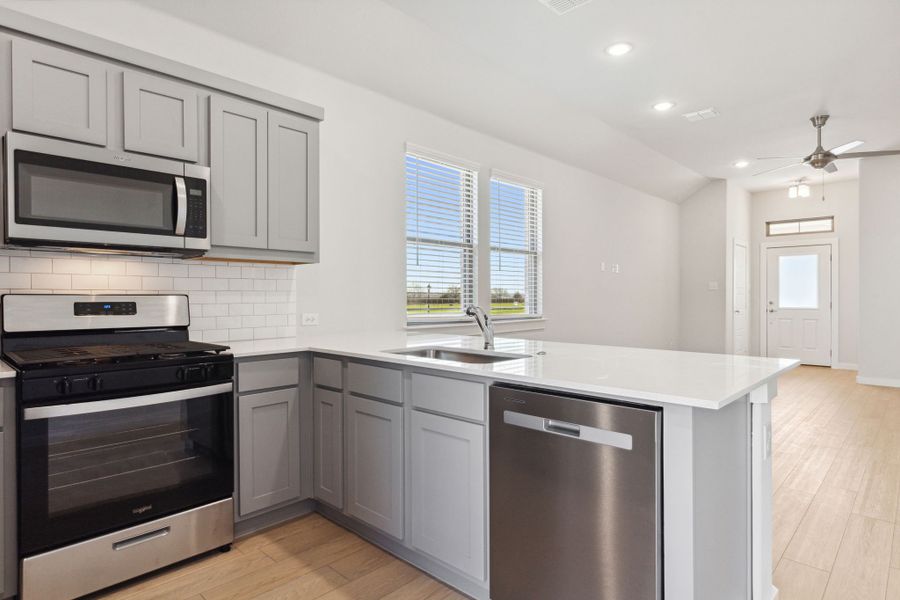 Kitchen in the Ash home plan by Trophy Signature Homes – REPRESENTATIVE PHOTO