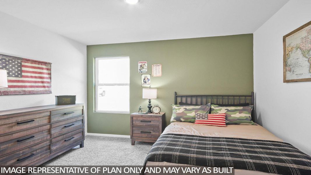 Bedroom with light colored carpet and baseboards