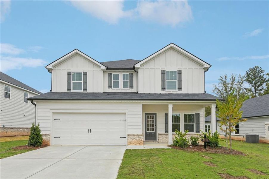Front exterior of a new home in Preserve at Mountain Creek, Pendergrass, GA, highlighting curb appeal (Image 1).