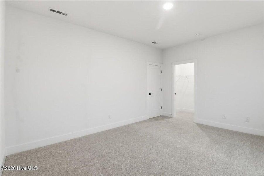 Spacious, unfurnished interior of a new home in Wood Creek Landing, Leland (Image 26).