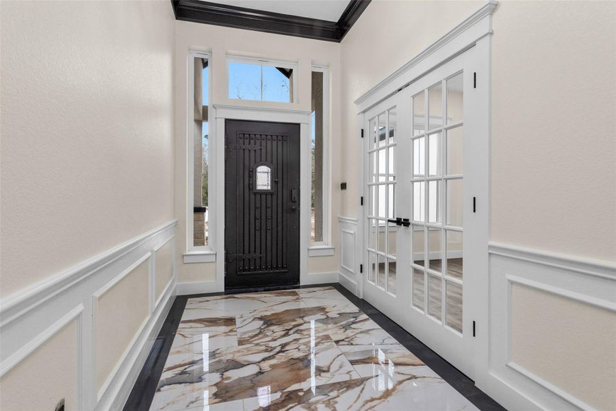 This is a rear view of the entry really showcasing that amazing Iron Front Door and Trim work. This is a rear view of the entry really showcasing that amazing Iron Front Door and Trim work.