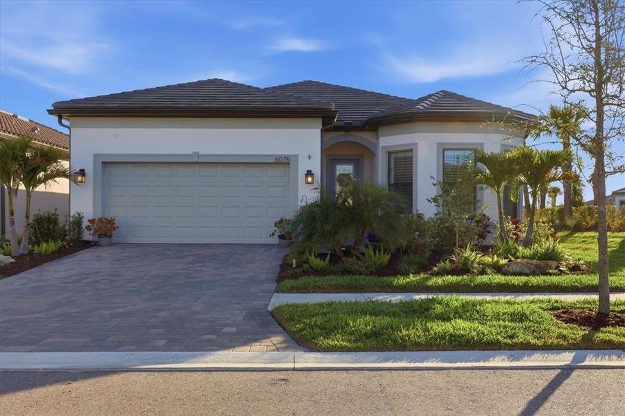 Front exterior of a new home in , Nokomis, FL, highlighting curb appeal (Image 22). Front exterior of a new home in , Nokomis, FL, highlighting curb appeal (Image 22).