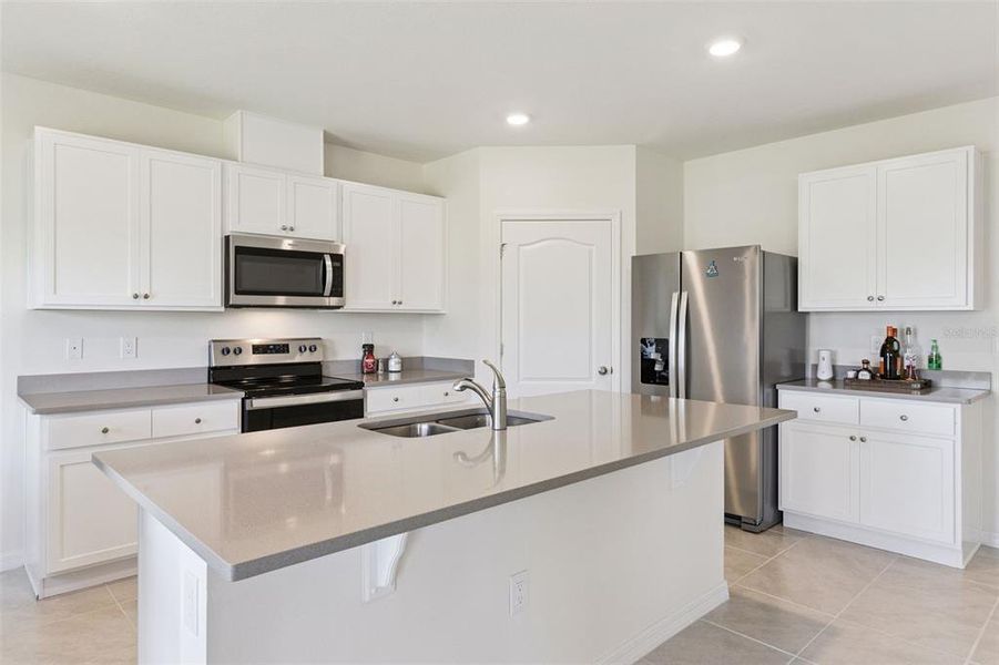 Furnished interior view inside a new home in Harmony at Lake Eloise, Winter Haven (Image 28).