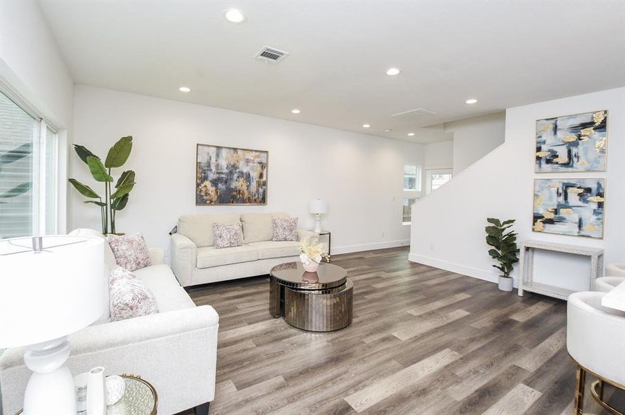 This is the bright, open view from the kitchen area, which seamlessly flows into your lush living space.