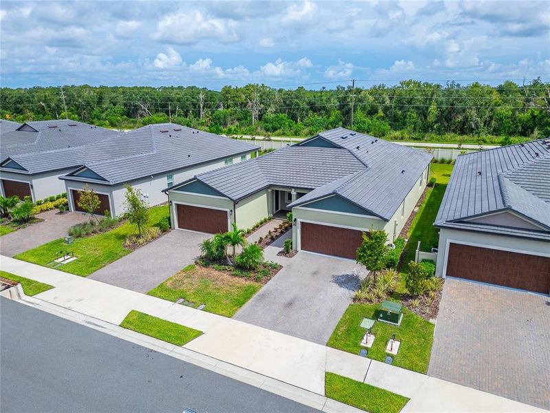 Front exterior of a new home in , Parrish, FL, highlighting curb appeal (Image 32).