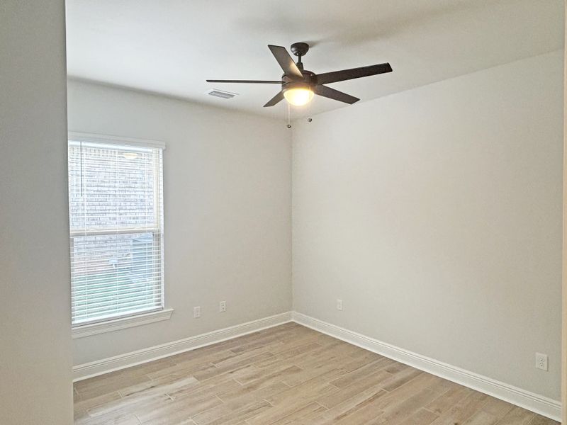 Spacious, unfurnished interior of a new home in Bird Song at Hammock Bay, Freeport (Image 21).