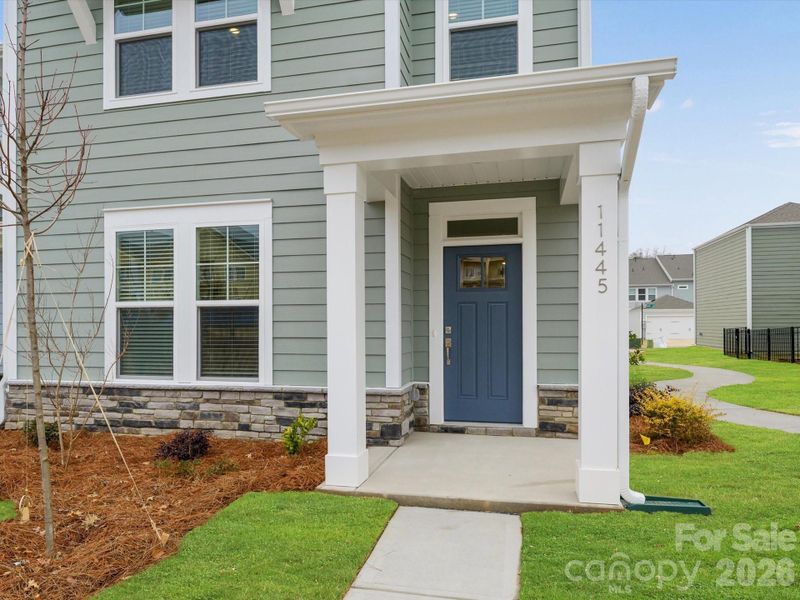 Exterior details and patio area of a home in North Creek Village, Huntersville (Image 19).