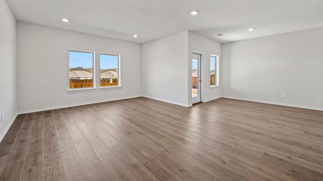 Unfurnished room with light wood-style floors and recessed lighting