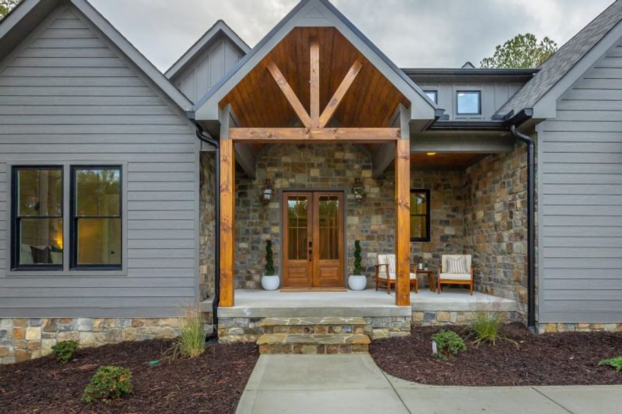 Exterior details and patio area of a home in River Gorge Ranch, Guild (Image 50).