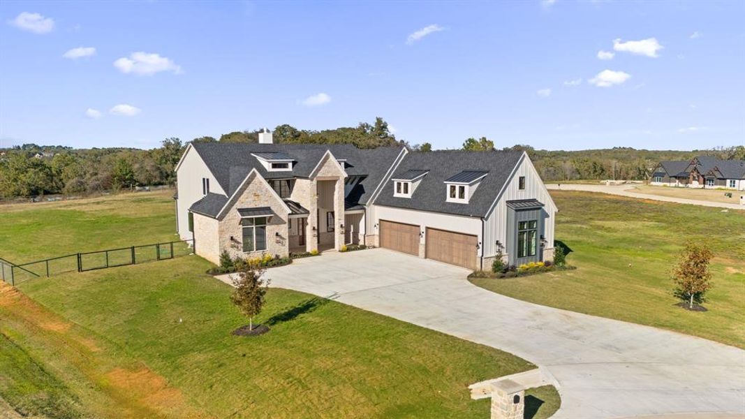 Front exterior of a new home in , Argyle, TX, highlighting curb appeal (Image 2).