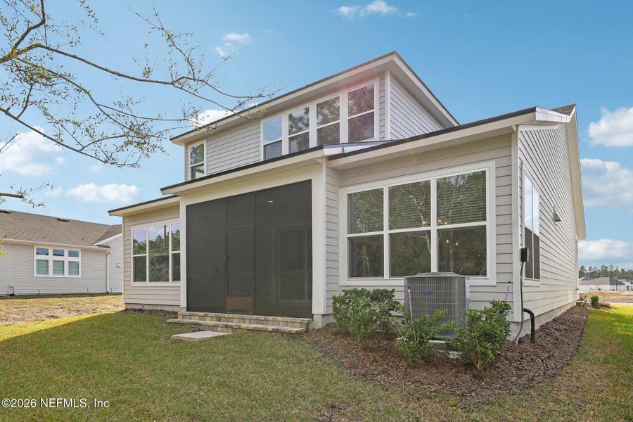 Front exterior of a new home in Middlebourne, St. Johns, FL, highlighting curb appeal (Image 28). Front exterior of a new home in Middlebourne, St. Johns, FL, highlighting curb appeal (Image 28).