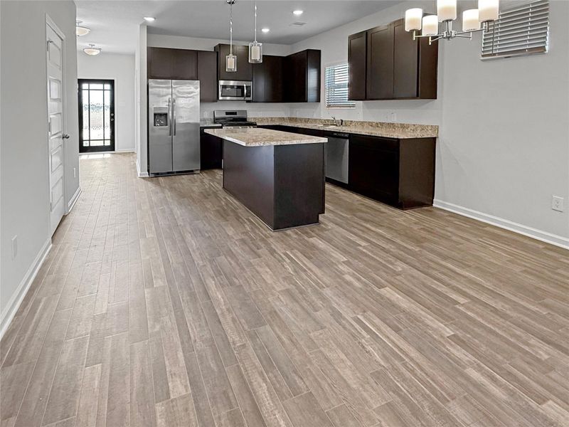 Furnished interior view inside a new home in Sierra Vista, Iowa Colony (Image 9).