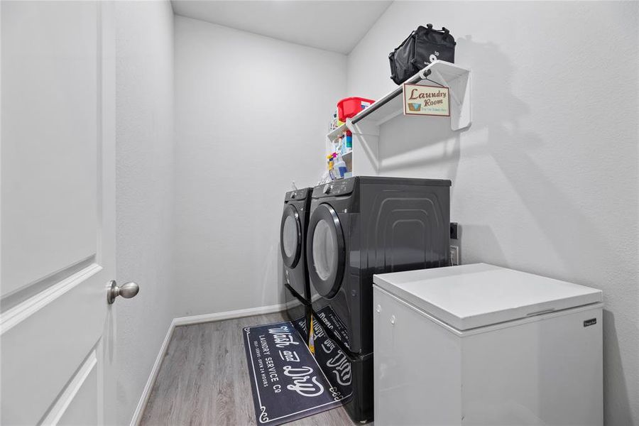 Large laundry room with enough space for a refrigerator or additional storage