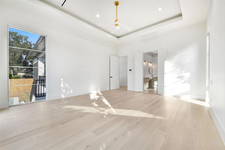 Suggested layout of the primary suite offering plentiful outdoor views Suggested layout of the primary suite offering plentiful outdoor views