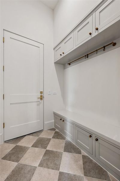 Mudroom off the garage also offers a large holiday storage closet that could be converted to an elevator in the future.