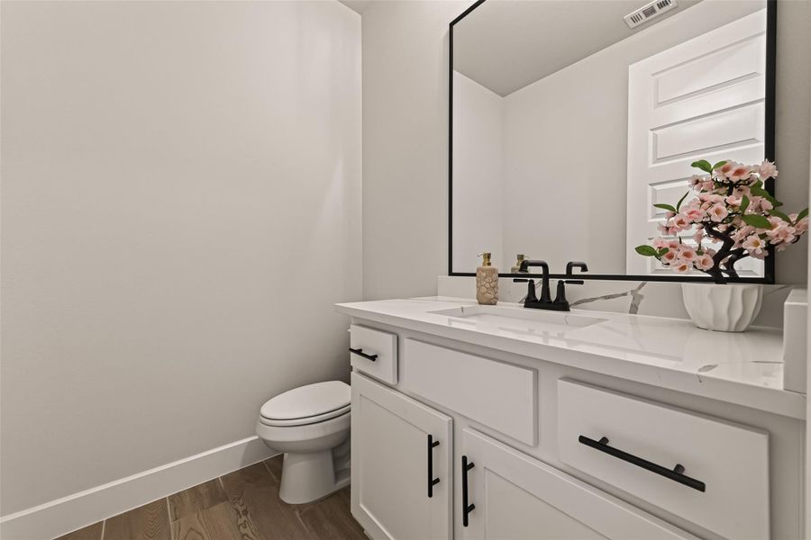 Convenient first-floor half bath for guests Convenient first-floor half bath for guests