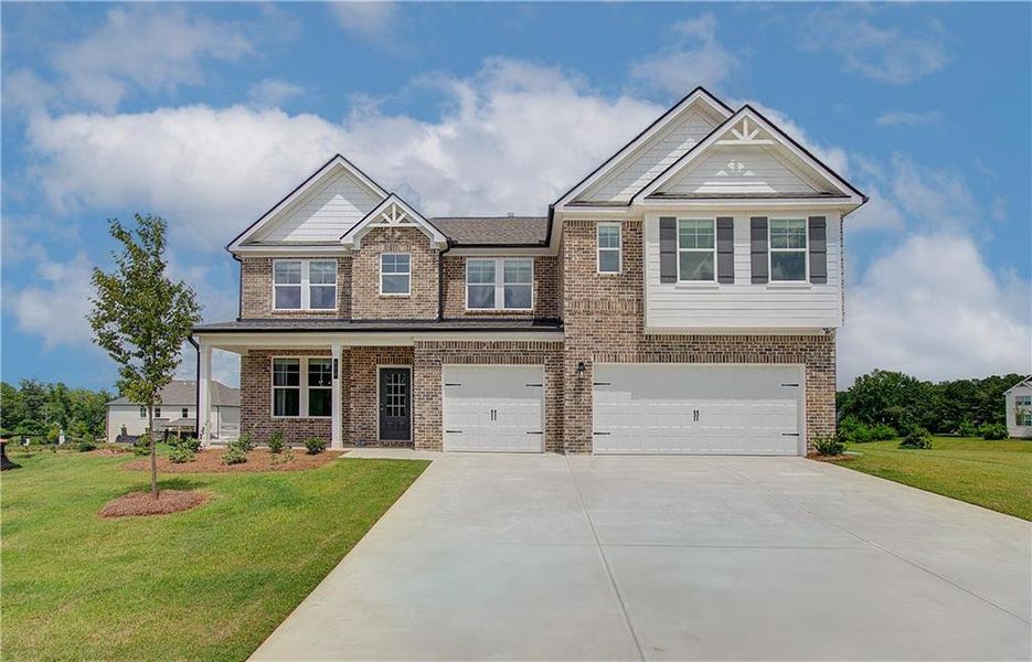 Front exterior of a new home in Westwind Estates, Hampton, GA, highlighting curb appeal (Image 20).