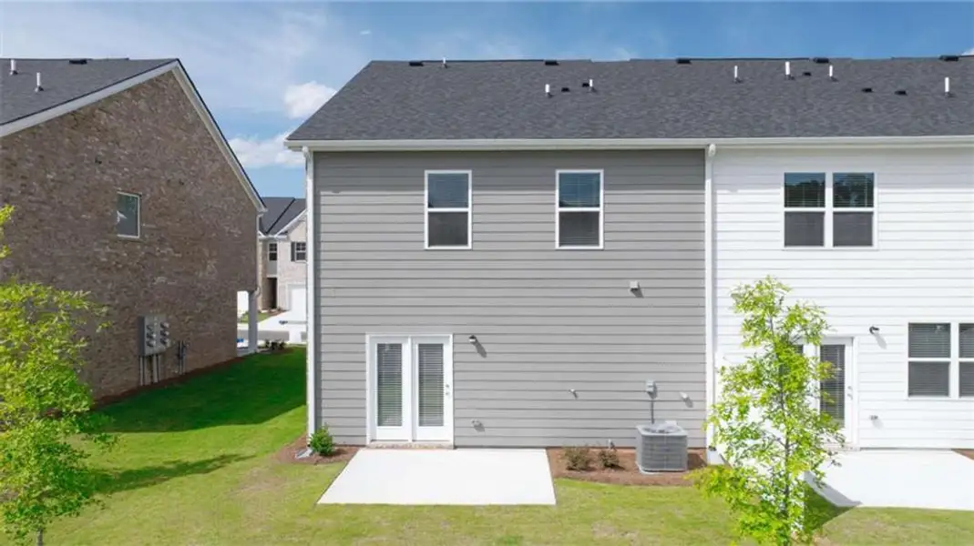Exterior details and patio area of a home in Echo Glen, Stockbridge (Image 4).