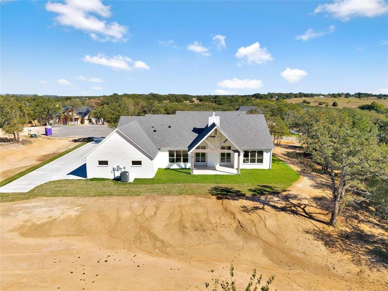 Front exterior of a new home in , Azle, TX, highlighting curb appeal (Image 1). Front exterior of a new home in , Azle, TX, highlighting curb appeal (Image 1).
