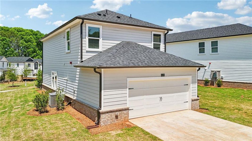 Front exterior of a new home in Hemingway - Cottage Series, Cumming, GA, highlighting curb appeal (Image 24). Front exterior of a new home in Hemingway - Cottage Series, Cumming, GA, highlighting curb appeal (Image 24).