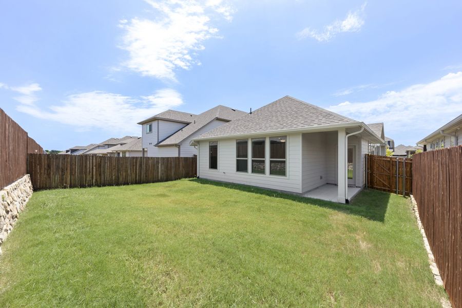 Exterior details and patio area of a home in Keeneland, Aubrey (Image 3).