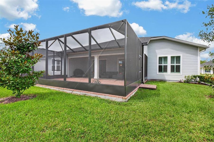 Exterior details and patio area of a home in Reverie at Palm Coast, Palm Coast (Image 4).