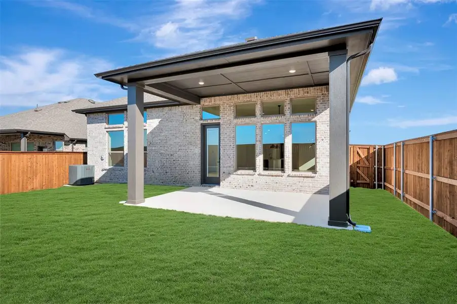 Exterior details and patio area of a home in Creekshaw – Classic, Royse City (Image 3).