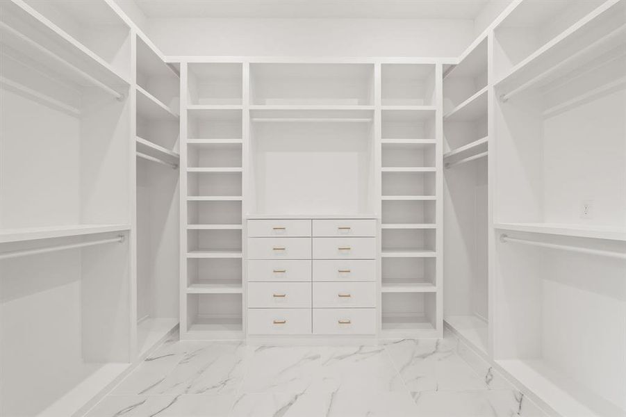 Mast Walk in closet featuring light marble finish floors Mast Walk in closet featuring light marble finish floors