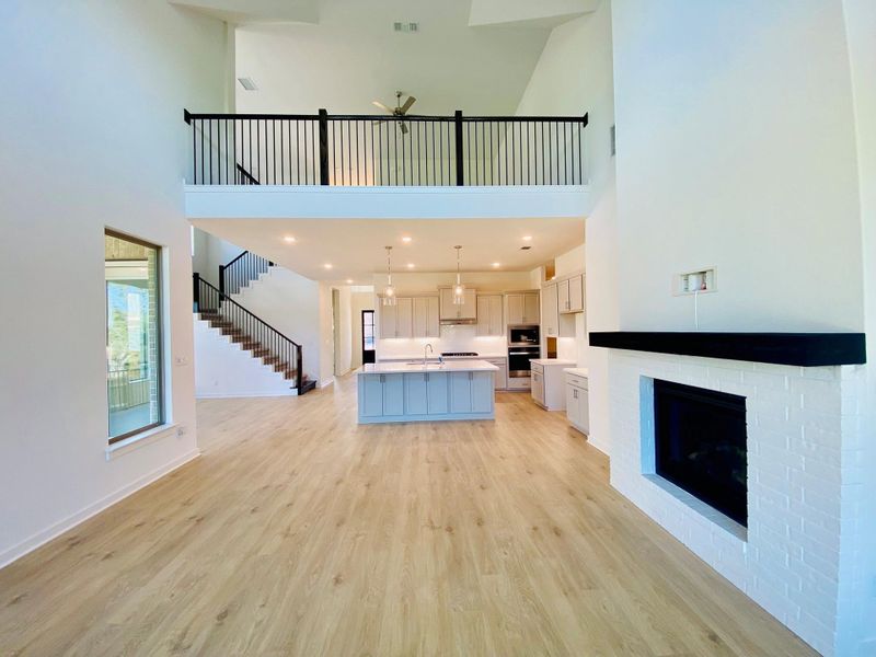 Family Room with soaring ceiling & fireplace