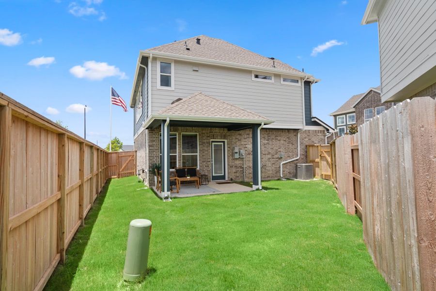 Exterior details and patio area of a home in Elyson, Katy (Image 19).