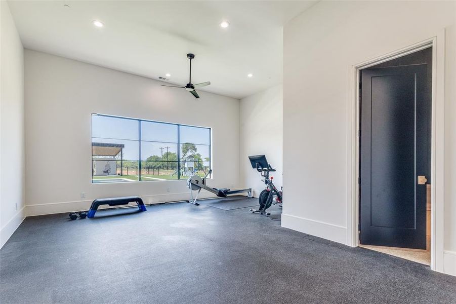 Exercise area with ceiling fan