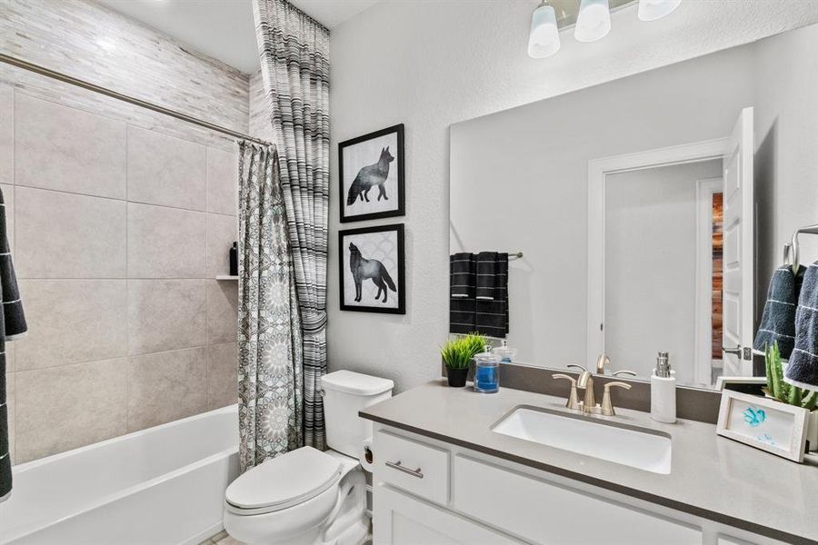 A full bathroom with a bathtub/shower combo on the second floor.