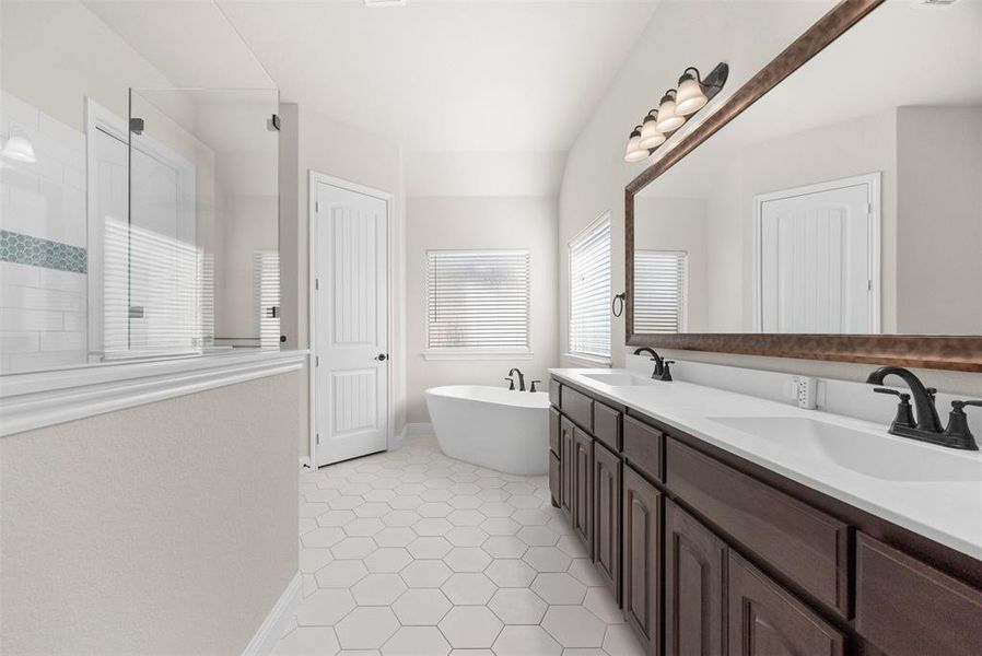 Bathroom with tile patterned floors, vanity, and shower with separate bathtub Bathroom with tile patterned floors, vanity, and shower with separate bathtub