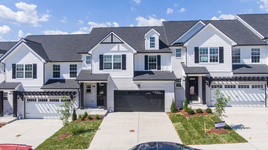 Front exterior of a new home in Stonecrest Townhomes, Hendersonville, TN, highlighting curb appeal (Image 1). Front exterior of a new home in Stonecrest Townhomes, Hendersonville, TN, highlighting curb appeal (Image 1).