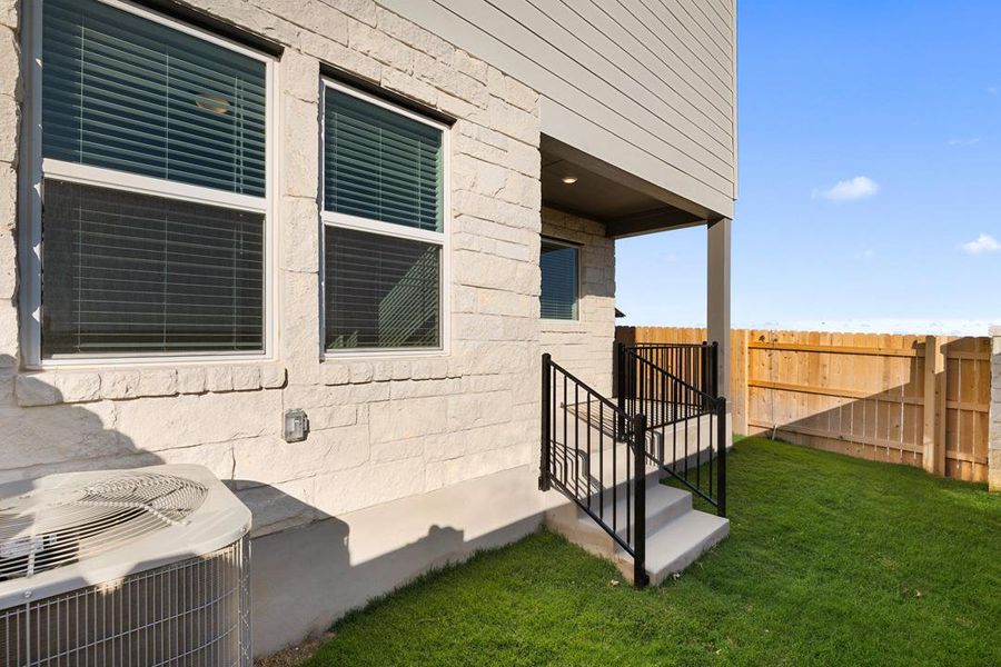 Exterior details and patio area of a home in Union Collection at Park Central, Georgetown (Image 24).